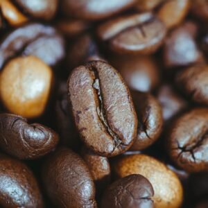 Detailed close-up of roasted coffee beans showcasing rich textures and natural colors.